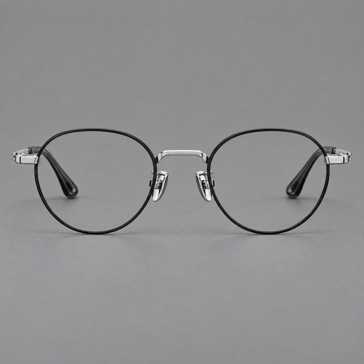 Small panto titanium glasses with an angular bridge and recessed temple details — Black and Silver — Front view [CINILY-JD2026-88058-C3]